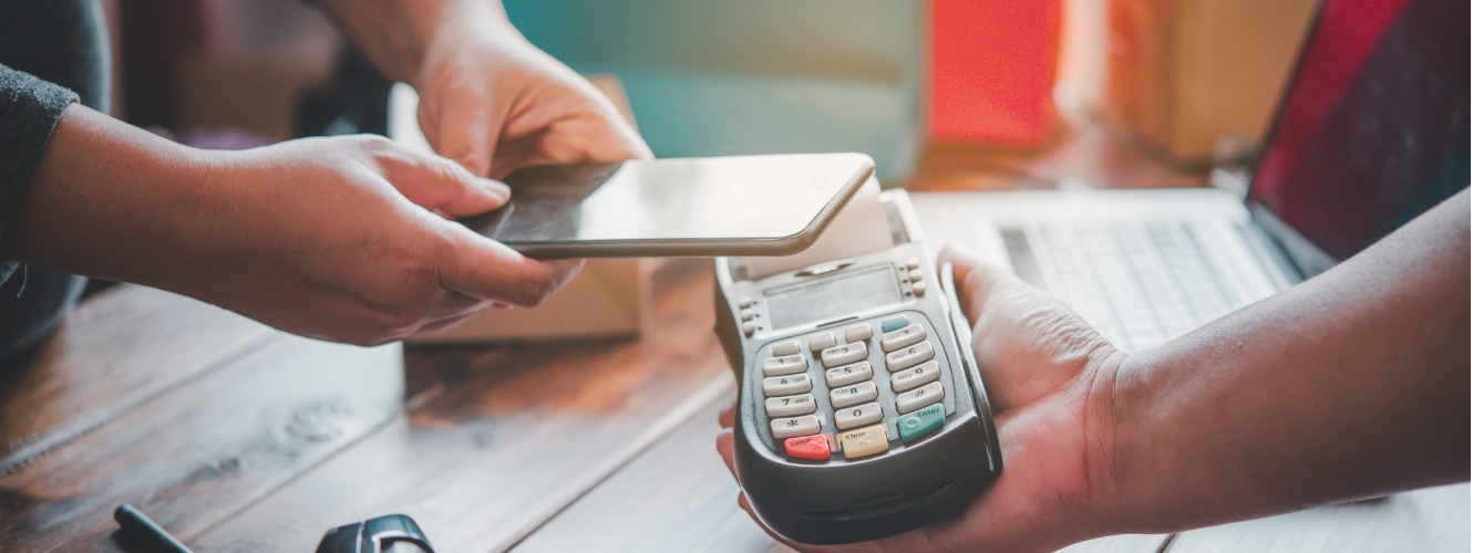 customer using a smart phone to make a payment