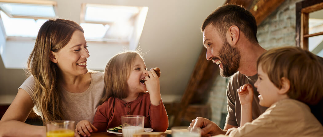 A young family eating at a table