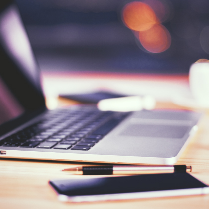 Laptop and mobile phone on table