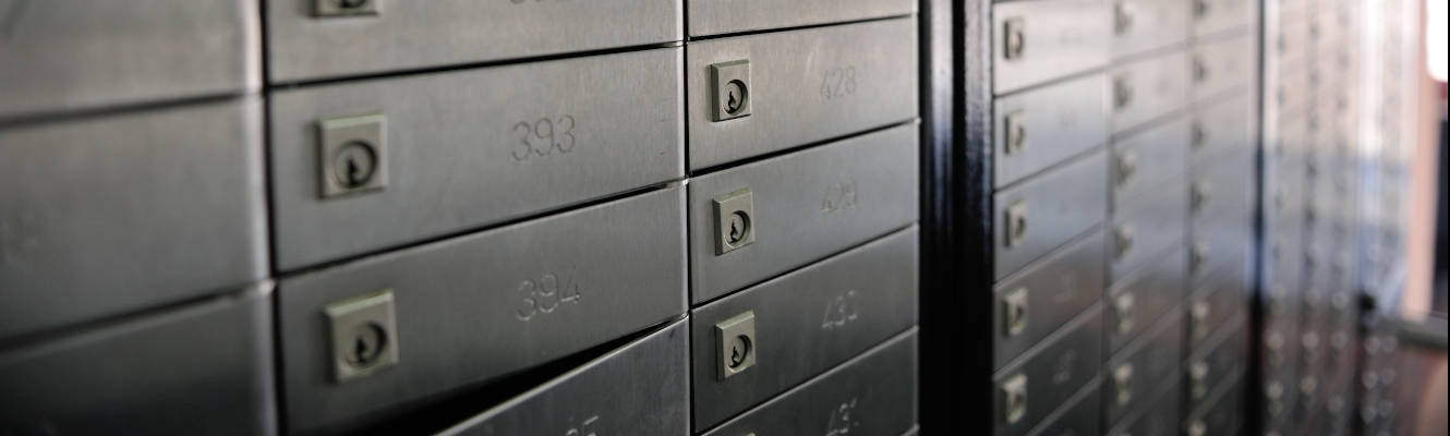 A wall of safety deposit boxes.