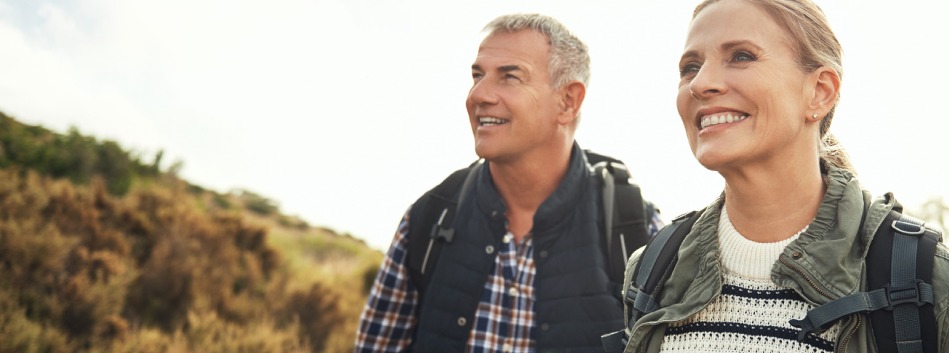 Mature couple walking outdoors