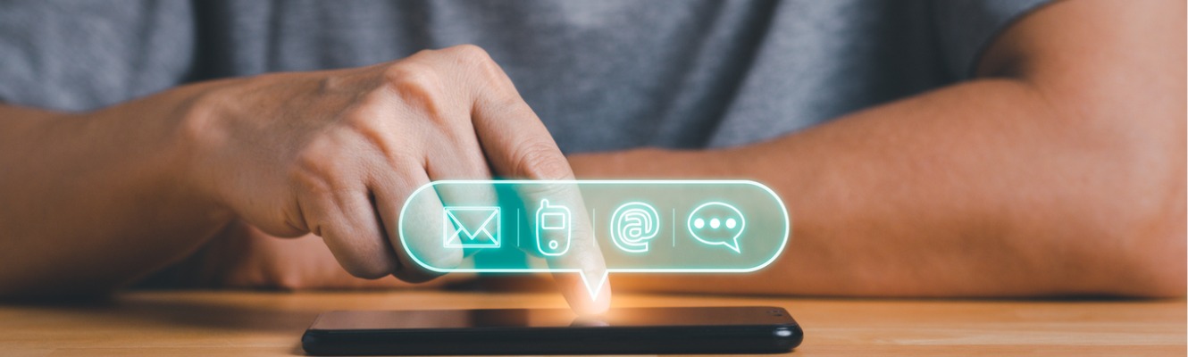 Man reading an email chat or communicating with other person via phone. 